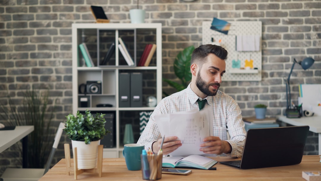 worker worried looking at document desk