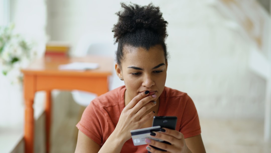 worried person checking credit card bill